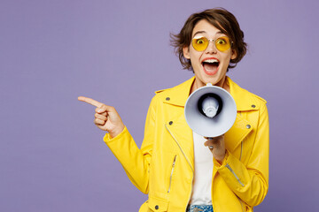 Young excited woman wears yellow shirt white t-shirt casual clothes glasses hold megaphone scream...