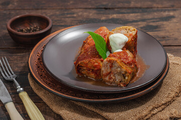 Cabbage rolls stuffed with rice and meat stewed in tomato sauce. Traditional dish, ready-to-eat food