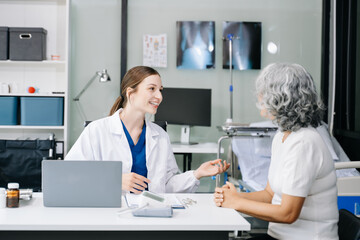 Portrait of female doctor explaining diagnosis to her patient. Doctor Meeting With Patient In Exam Room. A medical practitioner reassuring a patient .