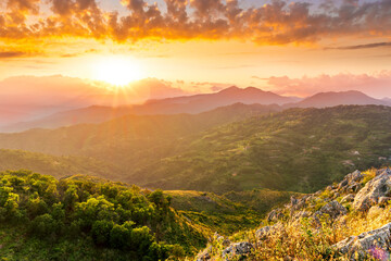 highland mountain landscape of beautiful sunset or sunrise with nice mountain peaks and slopes,...