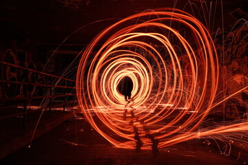 fire and flames steel wool photography in underground crossing