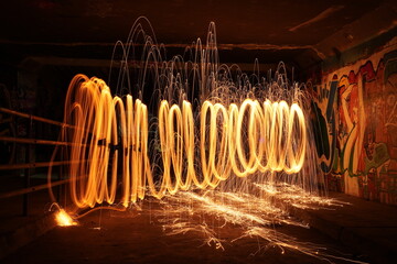 fire and flames steel wool photography in underground crossing