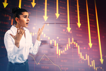 Worried young european businesswoman with red crisis arrows on blurry background. Economic...