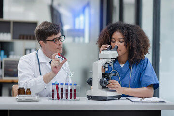 Medical science and microscope in laboratory for research concept. Two scientist with microscope Work in the lab.