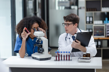 Medical science and microscope in laboratory for research concept. Two scientist with microscope Work in the lab.