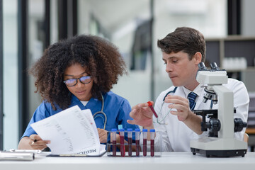 Medical science and microscope in laboratory for research concept. Two scientist with microscope...