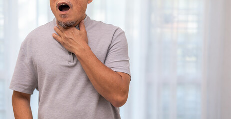 Sick senior man touching neck unwell coughing with sore throat pain,lung...
