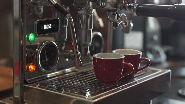 Coffee machine pouring fresh espresso