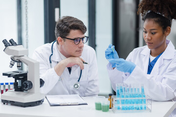 Scientist, Sustainability and sample, Doctor man using a microscope working in a laboratory for research or innovation.