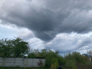 Thunderclouds before rain in the village