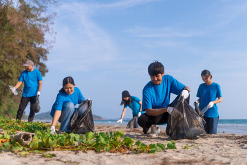 Plastic pollution and environmental problem concept. Happy asian diverse group of volunteers with...