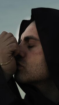 Religious Monk Kisses The Crucifix Jesus In Symbol Of Faith