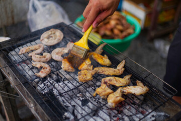 Grilled chicken thighs and wings on the street