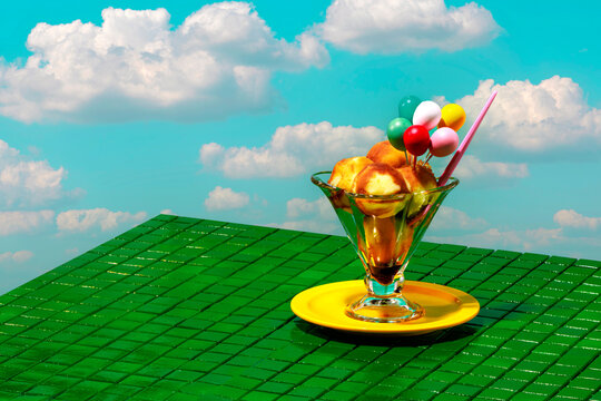 Fresh ice cream in glass against clouds