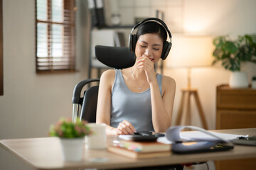 ฺAsia Businesswoman sitting and working using laptop to chat with customers online in office