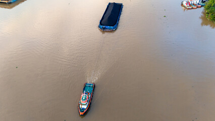 aerial view of a coal barge passing through a South Kalimantan river