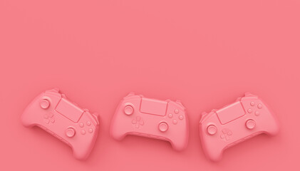Video game joysticks or gamepads in plain monochrome pink color background