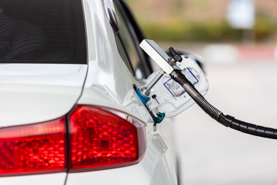 Close Up of pump nozzle Compressed Natural Gas (cng) in tank for car. Vehicle uses an energy system Natural Gas for Vehicles or NGV.