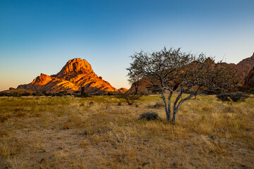 Spitzkoppe, aka Sptizkop - unique rock formation of pink granite in Damaraland landscape, Namibia, Africa.