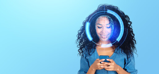 A smiling woman with digital face recognition graphics over her face, holding a phone, on a blue...