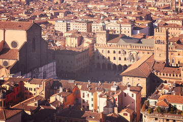 An aerial view of the famous Piazza Maggiore in Bologna, Italy. The photo showcases the historic...
