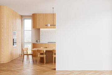 Modern kitchen interior with wood finish and empty white wall for mockups, light background,...