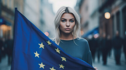 Woman holds the European Union flag in her hand. EU flag at a demonstration for EU accession
