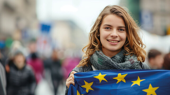 Woman holds the European Union flag in her hand. EU flag at a demonstration for EU accession