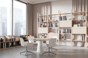 Cozy meeting room interior with table and chairs, shelf and panoramic window