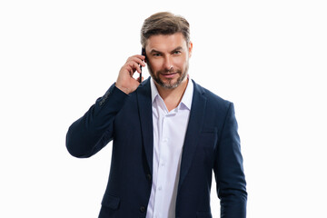 Fototapeta premium Portrait of handsome business man in suit using smartphone, chatting, making post on social media. Business man call on phone isolated over studio background. Blogger talking on phone.