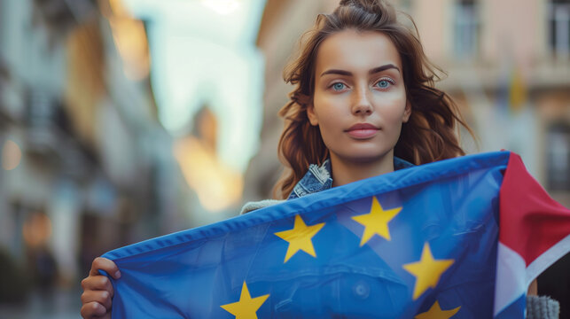 Woman holds the European Union flag in her hand. EU flag at a demonstration for EU accession