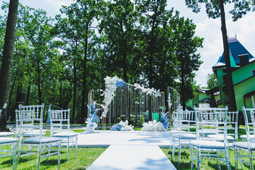 Arch for the wedding of the newlyweds. Arch of flowers on the background of the forest.