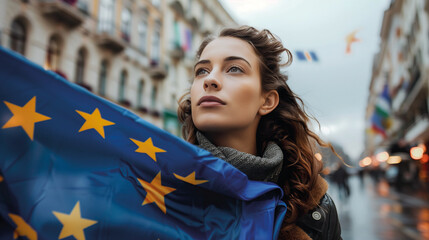 Woman holds the European Union flag in her hand. EU flag at a demonstration for EU accession