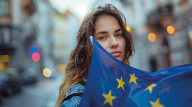 Woman holds the European Union flag in her hand. EU flag at a demonstration for EU accession