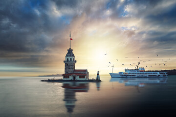 Beautiful landscape of Maiden Tower, sea gulls, sunset, clouds and bosphorus of Istanbul in Turkey.