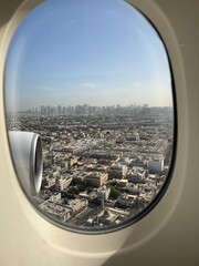 Fototapeta na wymiar Gazing out at the city skyline from an airplane window