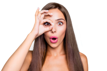 Portrait of young straight-haired lovely brunette cute sweet glam girl with plump lips, wearing pink top, showing ok-sign like glasses. Isolated over bright vivid turquoise background