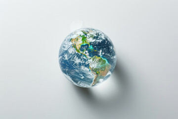 Environment conservation. Close-up human hands of a drop of clear water with a globe inside on a white background. Banner with copy space. Environment Earth Day. Saving environment, sustainable. Save