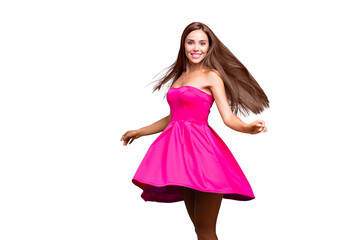 Young straight-haired sweet brunette smiling girl wearing pink dress, dancing, flirting, wind blows...