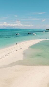 Aerial view of tropical sandy beach with palm trees. Bantayan island, Philippines.