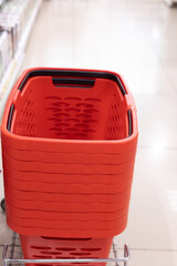 Shopping baskets nest to the shelves in a shop or supermarket, sale and promotion for food,...