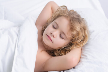 Obraz na płótnie Canvas Quiet sleep. Child sleeping on bed at home. Bedtime, kid sleeps. Child boy asleep on soft pillow with blanket.