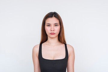 Portrait of a young asian woman wearing a black bodysuit, isolated on white