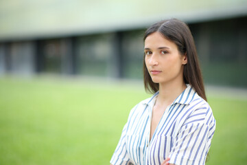 Serious woman looking at camera in a business center