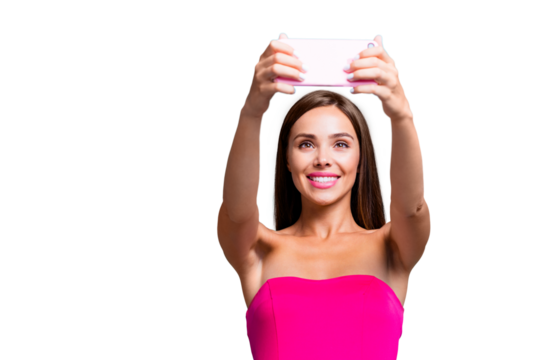 Young straight-haired sweet tender brunette smiling girl with long hair, wearing pink top, making selfie on smartphone. Copy space. Isolated over bright vivid teal turquoise background