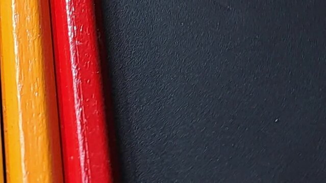 Swirl of colors with black background. Colors light blue amd green yellow and orange and red