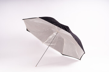 Photography studio light reflector - isolated on white background umbrella. - obrazy, fototapety, plakaty