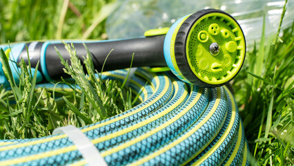 watering hoses on a green lawn
