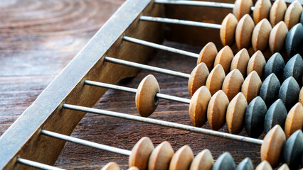 Vintage abacus or abacus on wooden background