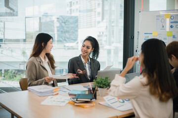 Team of Asian business people and working together in office, Startup projects and business presentation.
